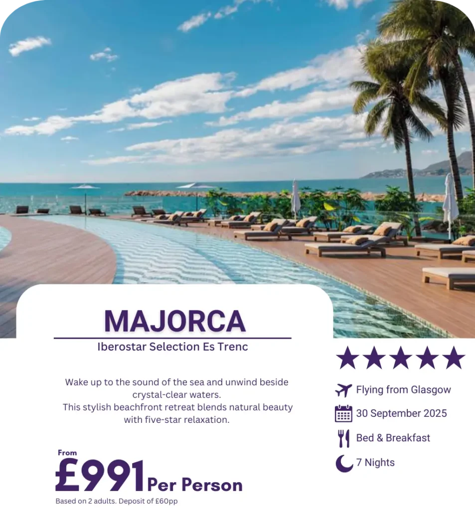 Seafront pool with loungers and palm trees at Iberostar Selection Es Trenc, Majorca.