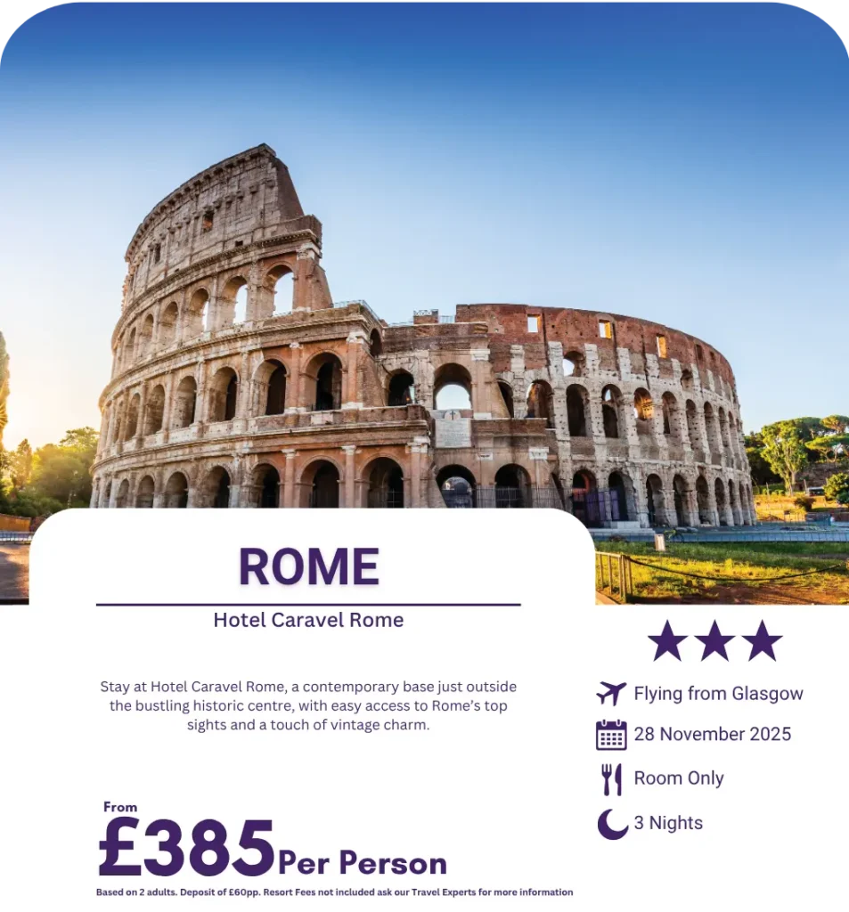 View of the Colosseum under blue skies in Rome, Italy